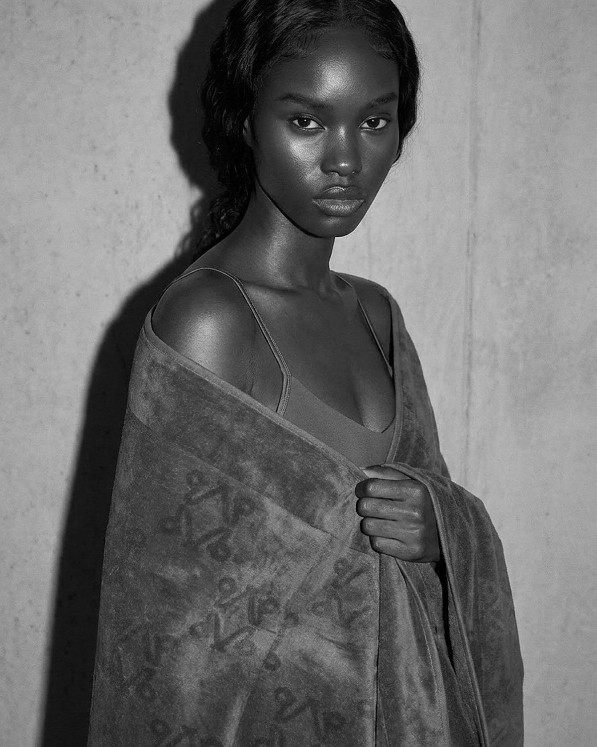 Model wrapped in a VELVET monogram towel, black and white